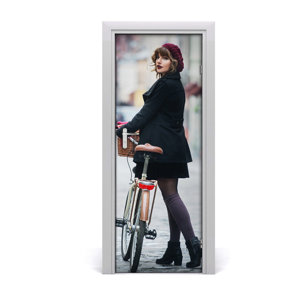 Fototapeta samolepiace na dvere Žena v barete s bicyklom
