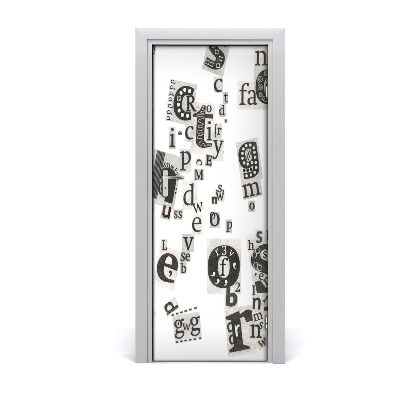 Fototapeta na dvere Roztrúsené vystrihnuté písmená