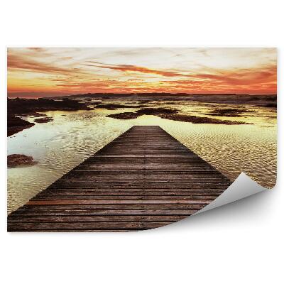 Fototapeta Perspektíva drevené mólo voda západ slnka