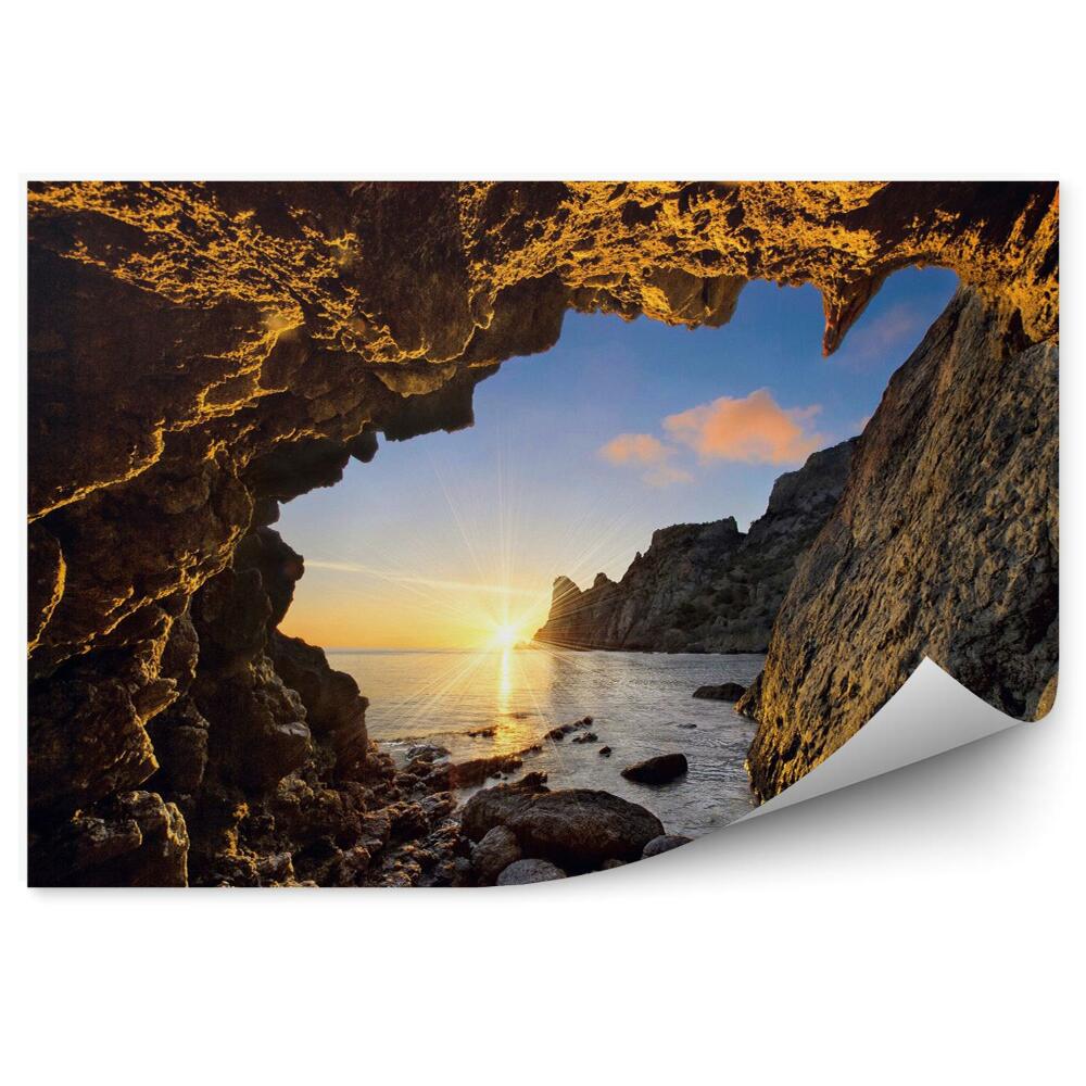 Fototapeta Západ slnka z horskej jaskyne more