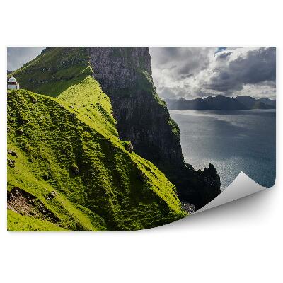 Fototapeta Kallur maják ovce ostrovy hory tráva oceán obloha mraky