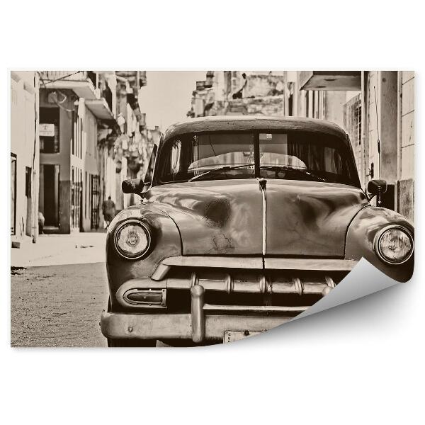 Fototapeta Historické červené auto zaparkované na ulici čiernobiele