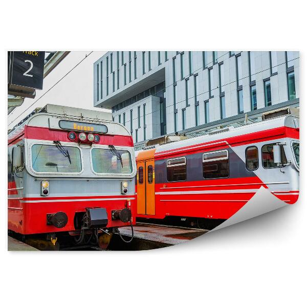 Fototapeta Rdeči vlaki na mestnem peronu potniki