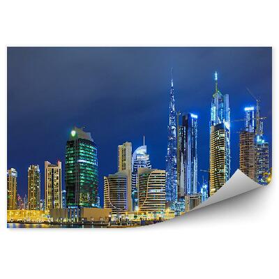 Fototapeta na stenu Mrakodrapy oceán more budovy nočné svetlo