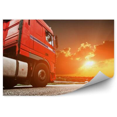 Fototapeta Červený kamión v pozadí pri západe slnka
