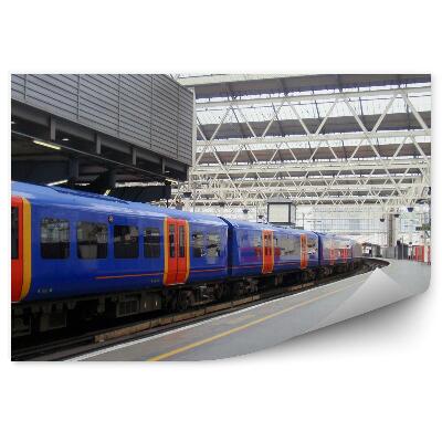 Fototapeta Velika svetlobna železniška postaja modri vlak
