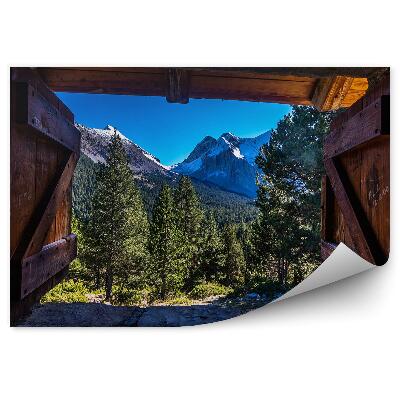 Fototapeta na stenu Horská krajina za oknom domčeka