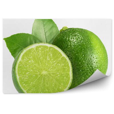 Fototapeta Limetka čerstvé ovocie nakrájané na polovice listy