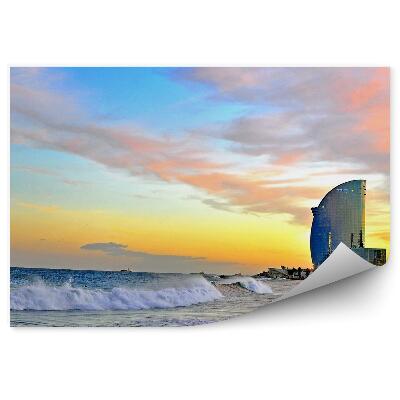 Fototapeta Mrakodrap vlny more západ slnka