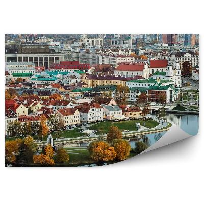 Fototapeta na stenu Panoráma mesta Minsk budovy stromy mosty autá západ slnka