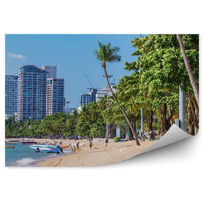 Fototapeta Mrakodrapy Palmy Slnečníky Ľudia Pláž Oceán Motorový Čln Obloha Mraky