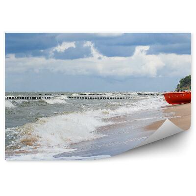 Fototapeta na stenu Morské vlny zamračená obloha piesok loď