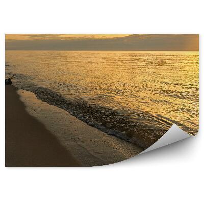 Fototapeta na stenu Oranžové svetlo slnka stopy na piesku