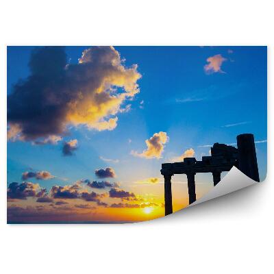 Fototapeta na stenu Rimske ruševine na ozadju zahajajočega sonca