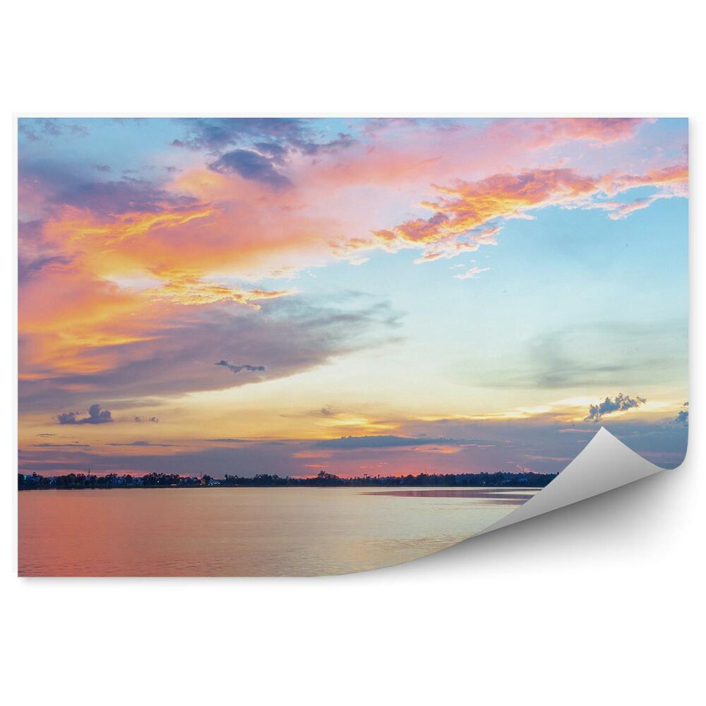 Fototapeta Farebná obloha pri západe slnka voda