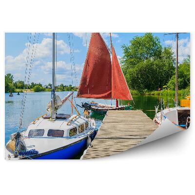 Fototapeta Leseni pomol pisani čolni zeleni