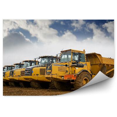 Fototapeta Rad sklápačov na pozadí oblohy