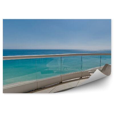 Fototapeta Balkónový výhľad oceán ležadlá na opaľovanie sklo pohľad na piesok