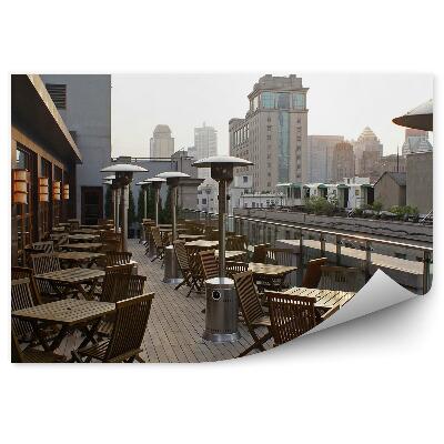 Fototapeta Budovy Terasa Stoličky Stoly Lampy Obloha