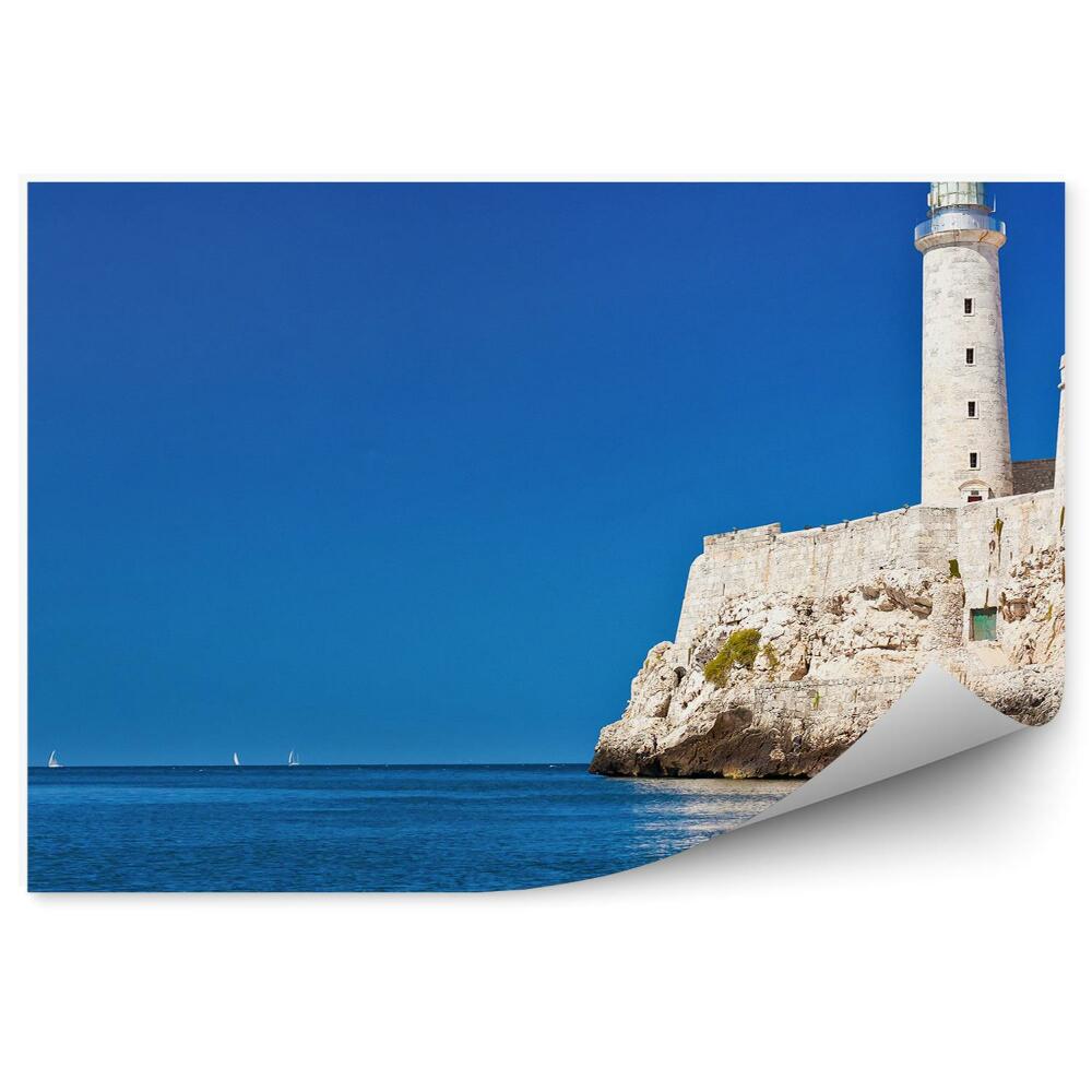 Fototapeta Maják na obzore s modrou morskou oblohou