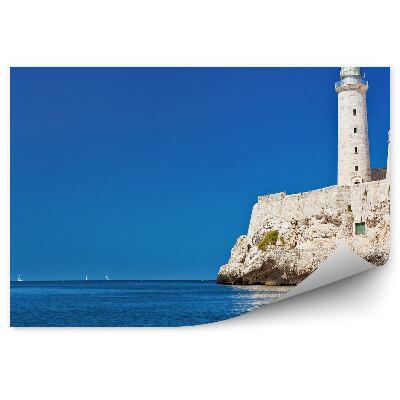 Fototapeta Maják na obzore s modrou morskou oblohou