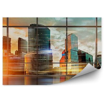 Fototapeta na stenu Pohyb svetla osvetľuje mesto za oknom