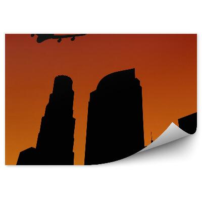 Fototapeta Lietadlo letiace nad tvarmi mesta