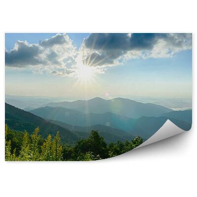 Fototapeta Východ slnka hory stromy obloha hmla mraky