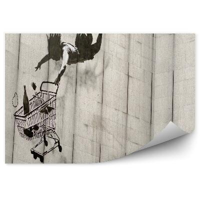 Fototapeta Skákajúca žena nákupný vozík tehla graffiti