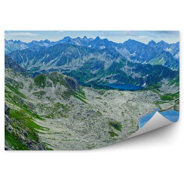 Fototapeta Panoráma hory tráva pohľad na jazero obloha mraky
