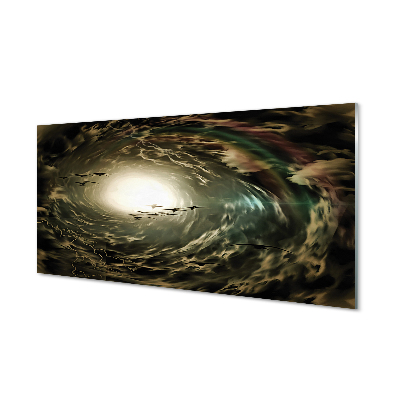 Obraz na skle Vtáky na pozadí sivých oblakov