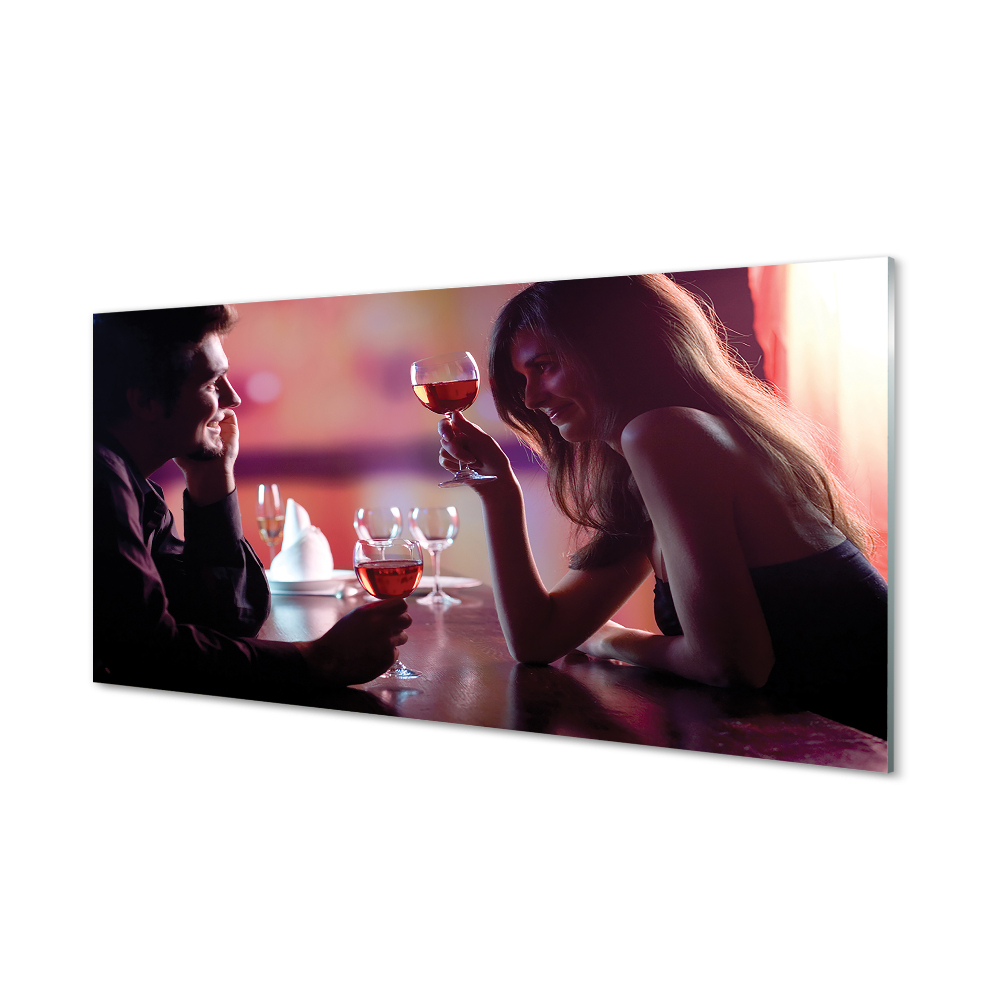 Obraz na skle Pár pri stole s pohármi