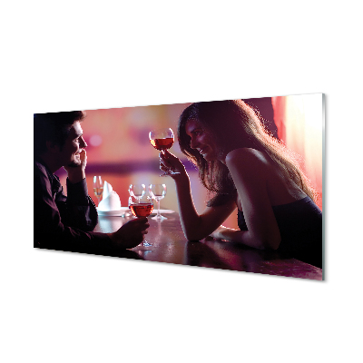 Obraz na skle Pár pri stole s pohármi