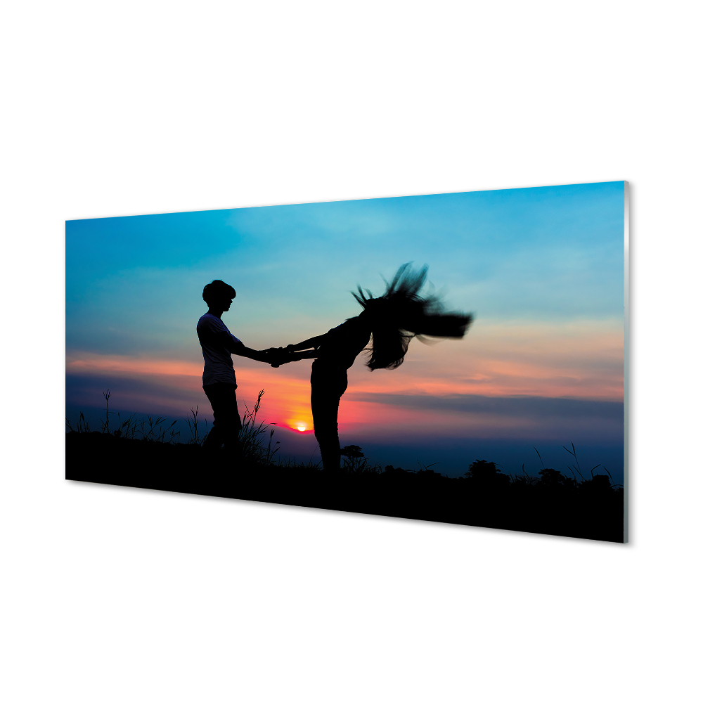 Obraz na skle Ľudia západná obloha na lúke