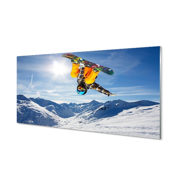 Obraz na skle Snowboardista robí zimné kúsky