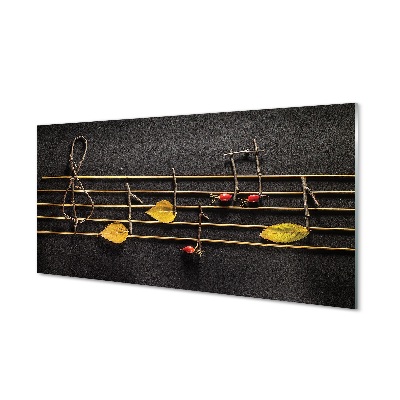 Obraz na skle Stavebná doska a noty s vetvičkami a listami