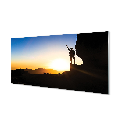 Skleneny obraz Muž na skale východ slnka